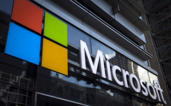 A Microsoft logo is seen on an office building in New York City, July 28, 2015. The global launch of the Microsoft Windows 10 operating system will take place on July 29. REUTERS/Mike Segar - RTX1M661