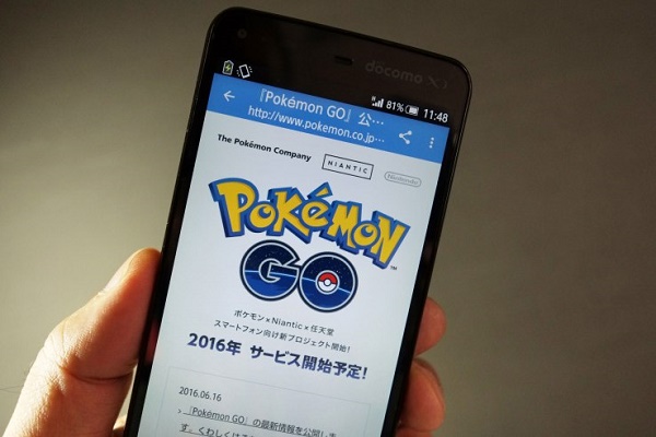 This photo illustration taken in Tokyo on July 13, 2016 shows the Pokemon official site through a Japanese internet website announcing the latest information for "Pokémon GO". With Pokemon-mania sweeping the planet, Nintendo's nascent shift into mobile gaming has proved a massive hit, vindicating the Japanese videogame giant's decision to unshackle itself from a long-standing consoles-only policy. / AFP / KAZUHIRO NOGI / TO GO WITH Japan-US-IT-Nintendo-Pokemon-lifestyle,FOCUS by Harumi OZAWA (Photo credit should read KAZUHIRO NOGI/AFP/Getty Images)