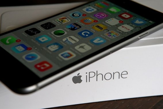 SAN ANSELMO, CA - JANUARY 27:  An Apple iPhone sits on a box on January 27, 2015 in San Anselmo, California.  Apple Inc. reported huge first quarter earnings that were fueled by strong iPhone sales with revenue of $74.6 billion compared to $57.6 billion one year ago.  (Photo Illustration by Justin Sullivan/Getty Images)