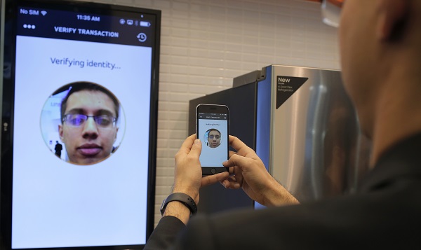 Raghav Malik, Senior Analyst in Enterprise Security Solutions doing a product demonstration of Identity Check in MasterCard stand at the Mobile World Congress in Barcelona, Spain, Monday, Feb. 22, 2016. The company displayed the future of payments for devices and wearables. (Carlos Alonso/AP Images for MasterCard)