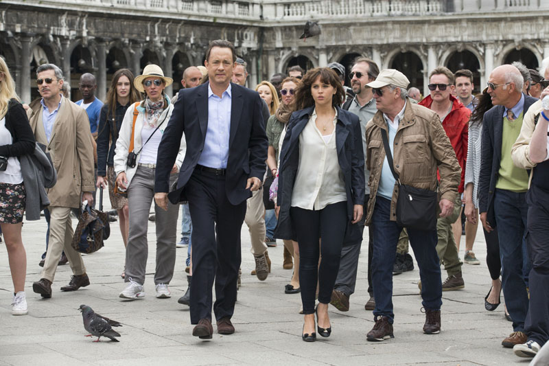 Langdon (Tom Hanks) and Sienna (Felicity Jones) make their way through St. Marks Square in Venice in Columbia Pictures' INFERNO.