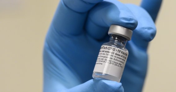 Army Spc. Angel Laureano holds a vial of the COVID-19 vaccine, Walter Reed National Military Medical Center, Bethesda, Md., Dec. 14, 2020. (DoD photo by Lisa Ferdinando)