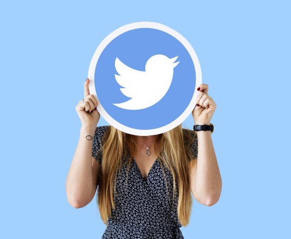 Woman showing a Twitter icon