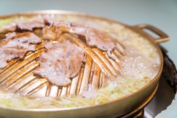 pork sliced grilling on hot pan - asian style