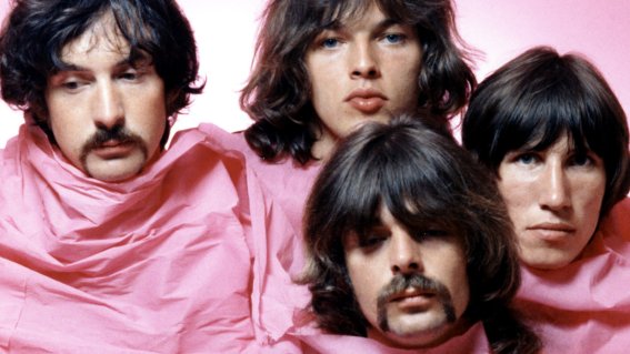 LOS ANGELES - AUGUST 1968: Psychedelic rock group Pink Floyd pose for a portrait shrouded in pink in August of 1968 in Los Angeles. (L-R) Nick Mason, Dave Gilmour, Rick Wright (center front), Roger Waters. (Photo by Michael Ochs Archives/Getty Images)